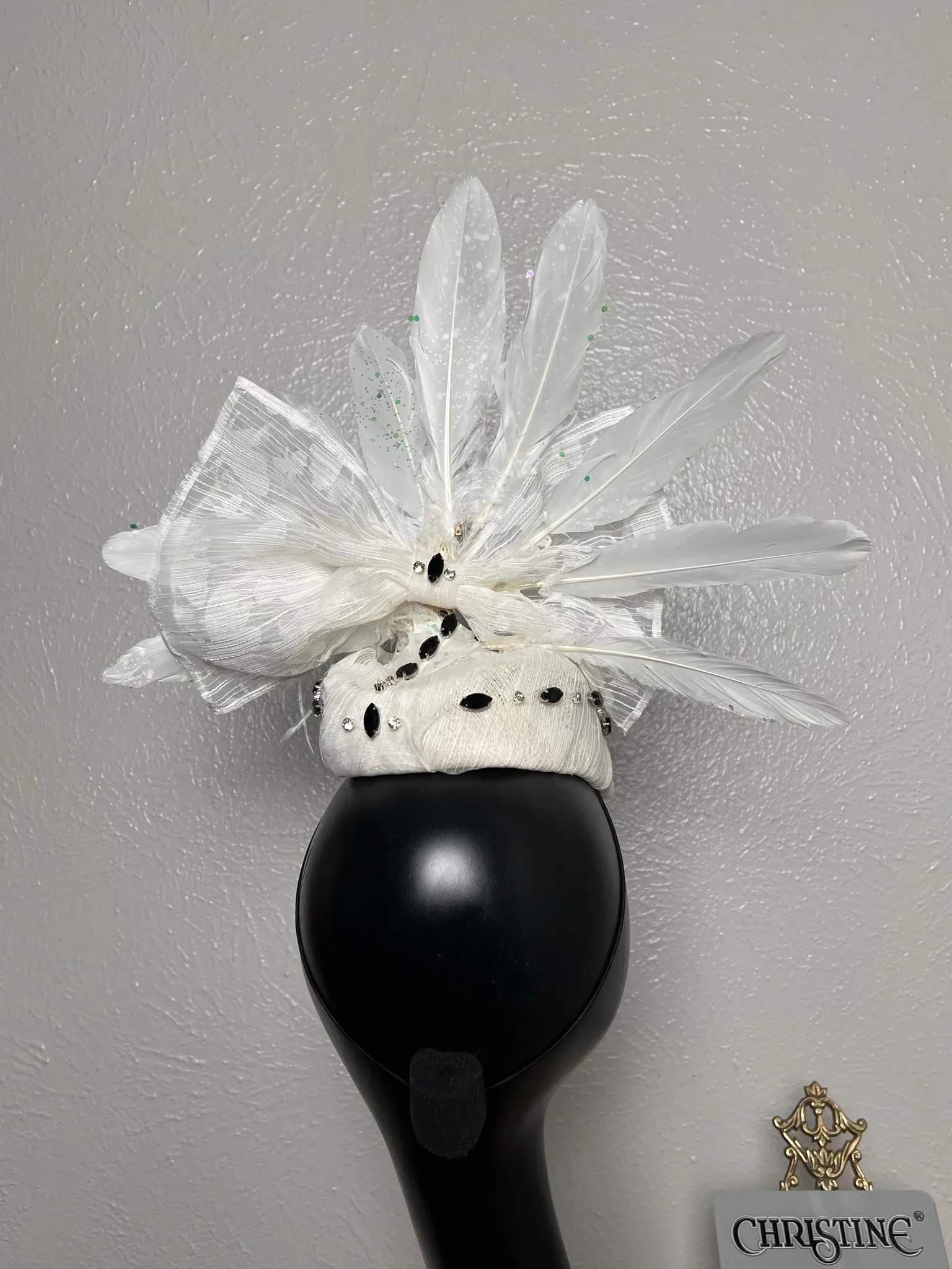 White hat Peacock spreads its wings